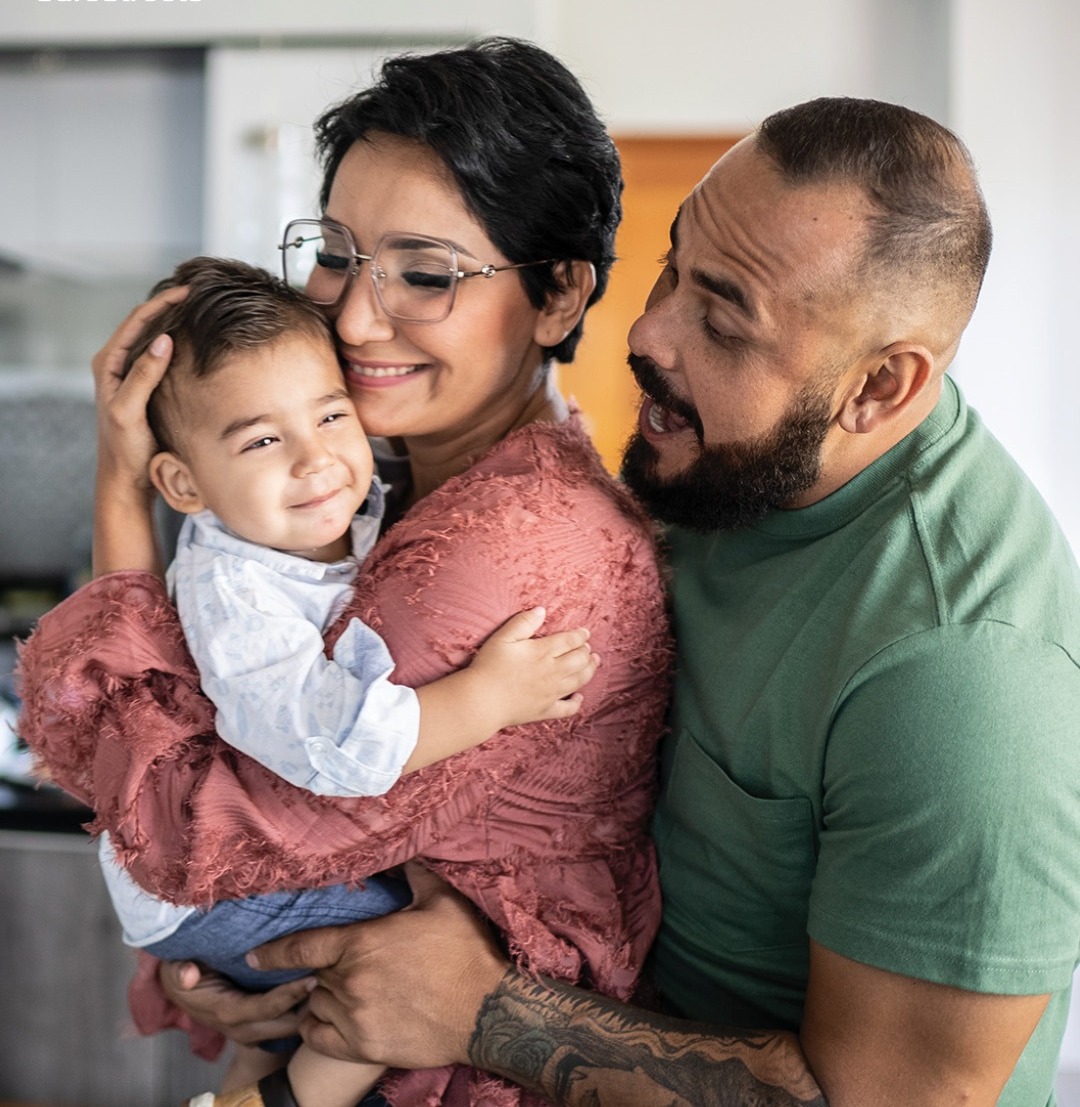 Family at home with ADT-monitored security options