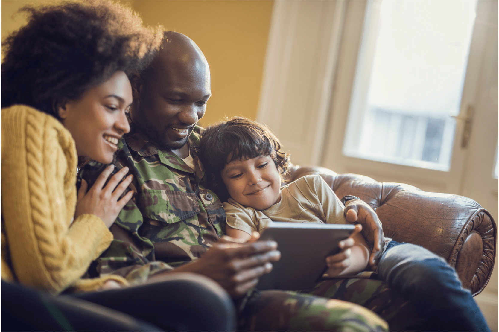 Family at home using a tablet